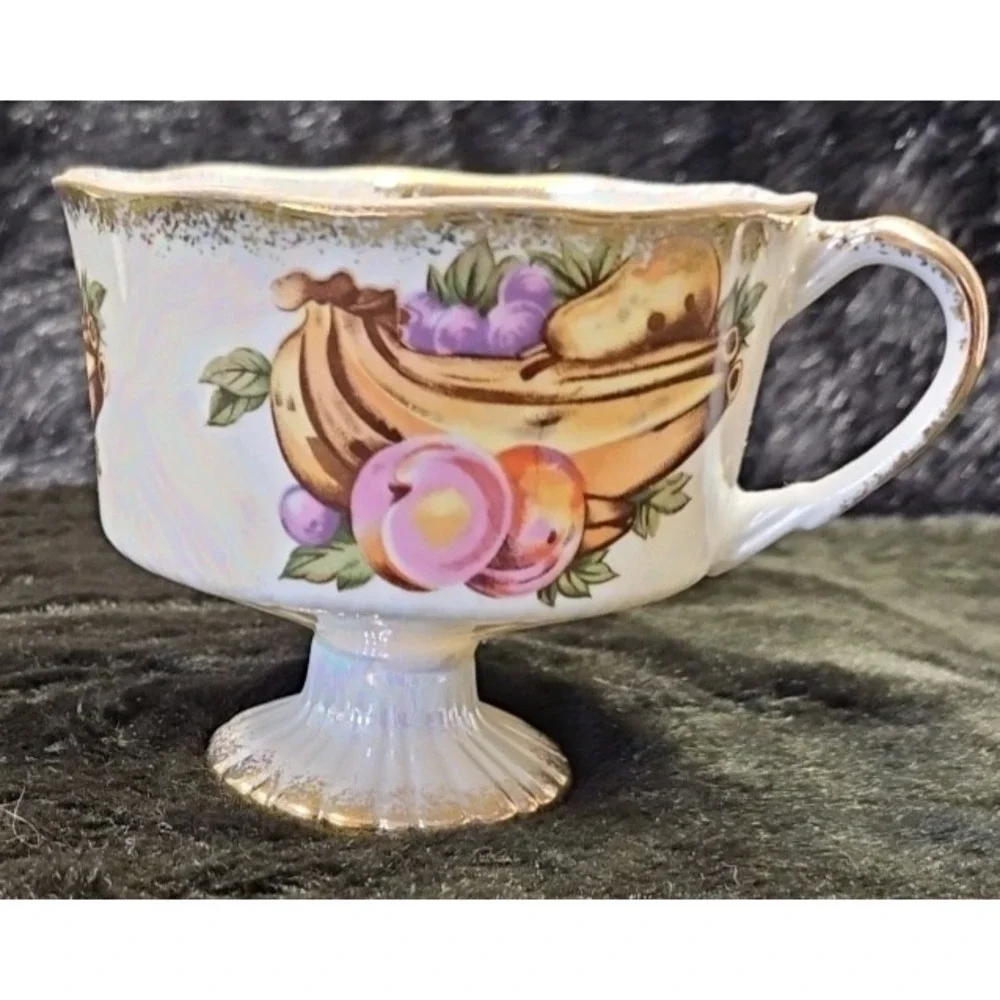 Lusterware Handpainted Fruit with gold finishings,‎ footed cup and saucer set